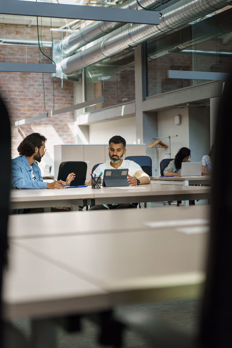 Engineers collaborating on a modern tech project